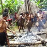Papuan_Woman_Cooking_Harvest_Feast